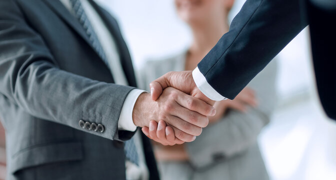 Business partnership handshake